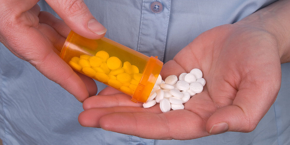 utah opiate abuse a man pours pills into his hand and thinks about the utah opiate abuse