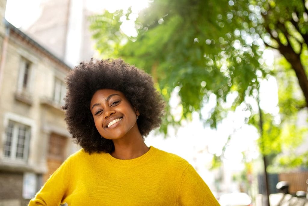 a woman smile after learning about recovery ways