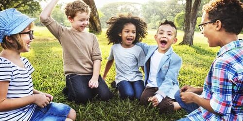 09657 As children play on the grass, it begs the question how does our addiction impact us as parents