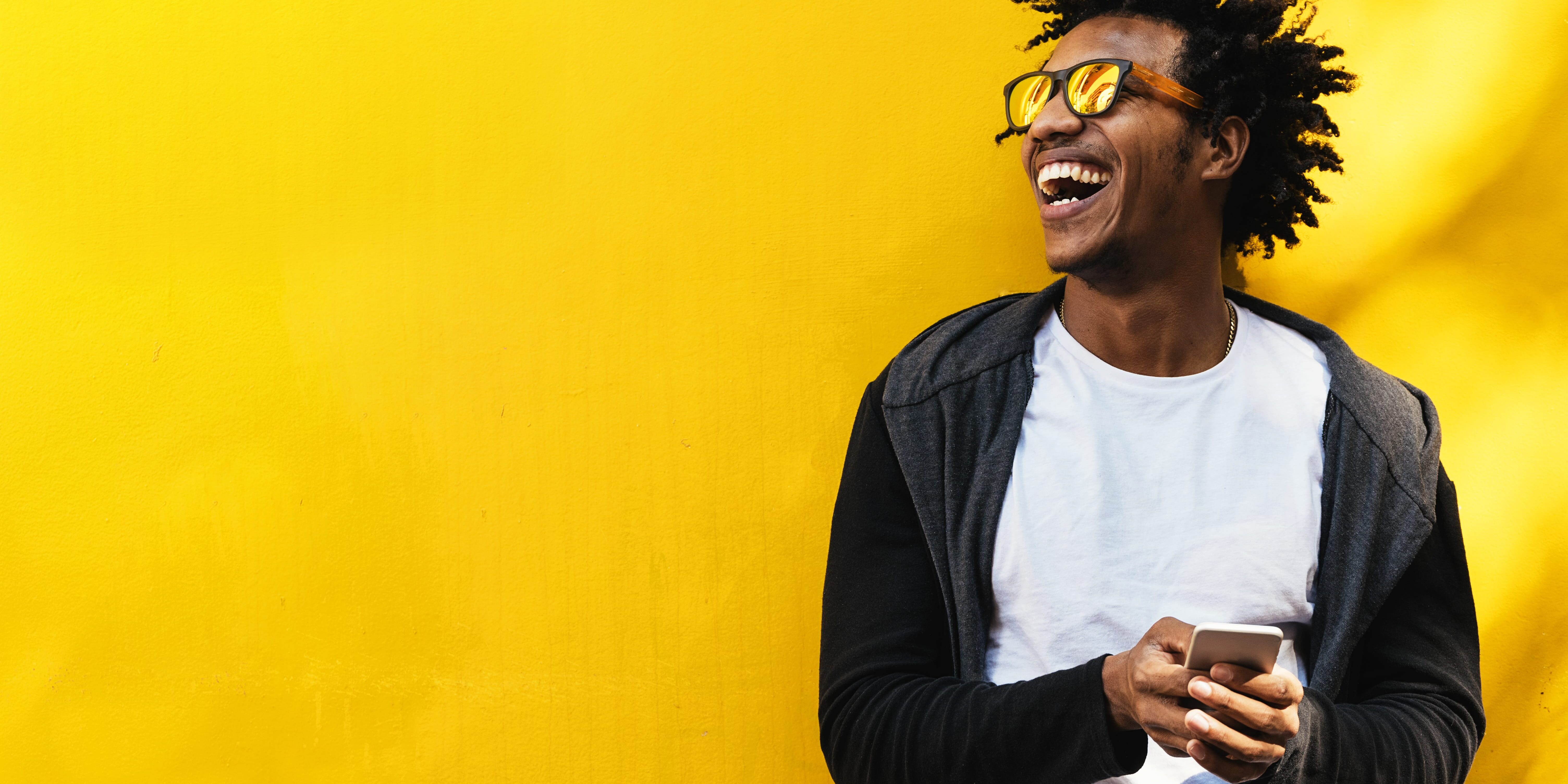 A man laughs joyfully when he remembers March 30th is World Bipolar Day