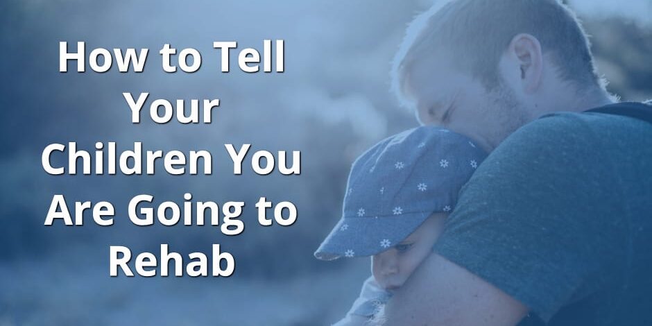 a man hugs his baby daughter and wonders how to tell your children you are going to rehab