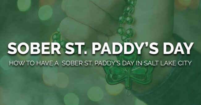 a person holds a shamrock and considers how to have a sober st paddys day in salt lake city