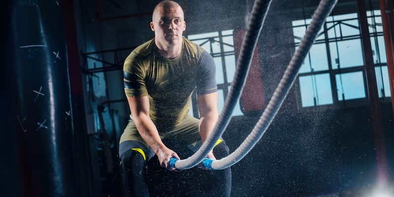Staying-Active-Healthy-and-Sober-in-Utah a man uses thick cables as he tries to stay active, healthy, and sober in utah