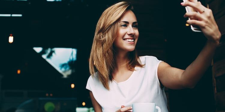 A woman takes a selfie as she takes aftercare to a new level