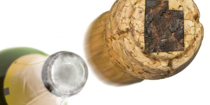 cork of champagne comes off as a person celebrates the beginning of finding alcohol treatment in salt lake city