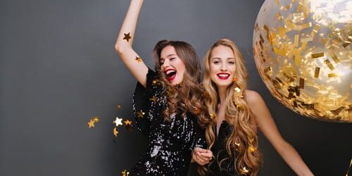 awrgy35 Two women cheer as they remember 5 new year's resolutions for people in recovery