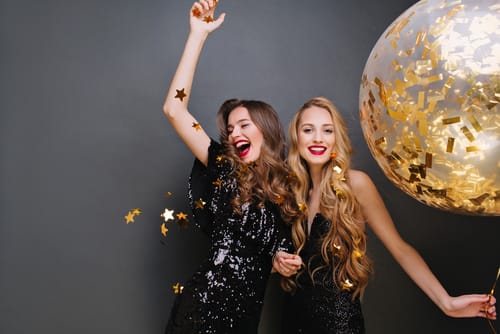 awrgy35 Two women cheer as they remember 5 new year's resolutions for people in recovery