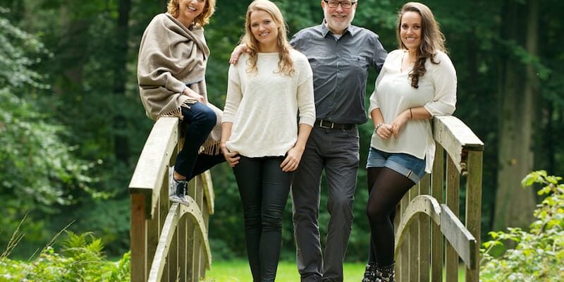 a family stands on a bridge as they talk about how to get your family member the help they need