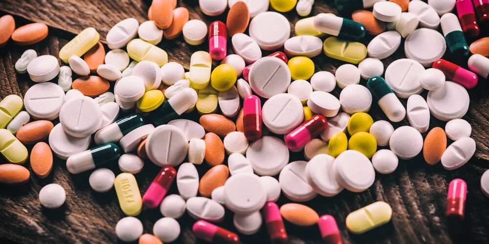 millennials-and-prescription-addiction piles of pills represent the dangers of prescribing millennials prescription drugs