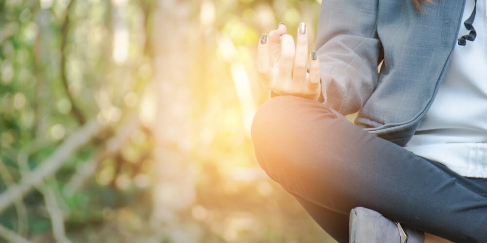 a woman practices mindfulness and meditation