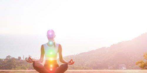 shutterstock_1042277725 a woman uses meditation as one of her coping skills for addiction recovery