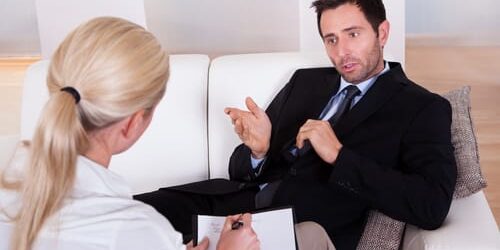 a man asks his therapist about the relationship between unemployment and addiction