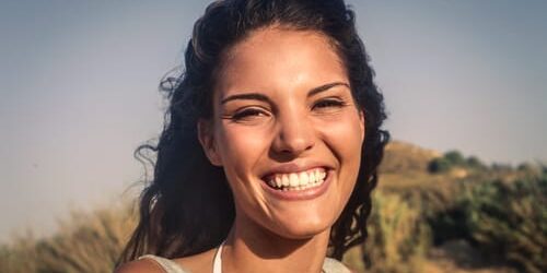 A woman smiles when she learns about what post-traumatic growth is