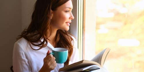 Occupational Therapy a woman reads about the dangers of mixing caffeine and alcohol