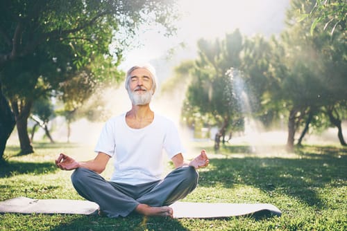 a man meditates and thinks about how mindfulness can help you manage cravings