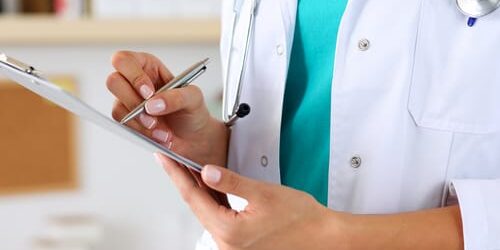 shutterstock_552209281 a doctor examines the difference between opiates and opioids