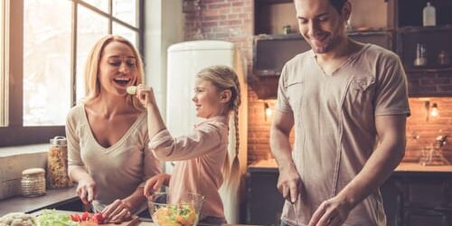shutterstock_556492396 a family cooks together as they talk about why recovery goals are important