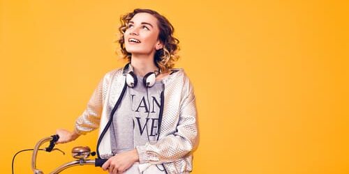 a woman with a bike wonders how can i change my limiting beliefs