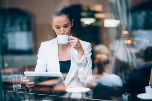 a woman drinks coffee and wonders is addiction a learning disorder