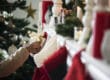 a person pulls a gift from a stocking and thinks about holidays and the anniversary effect