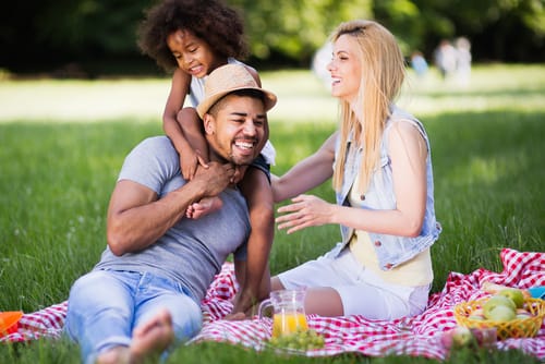 a man talks about the importance of family involvement with his wife and daughter