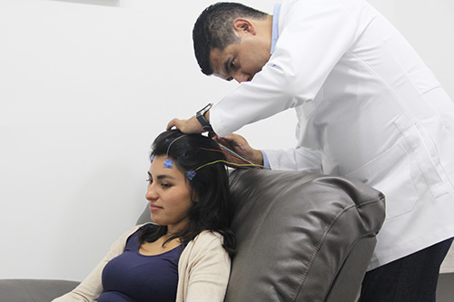 a woman participating in neurofeedback therapy