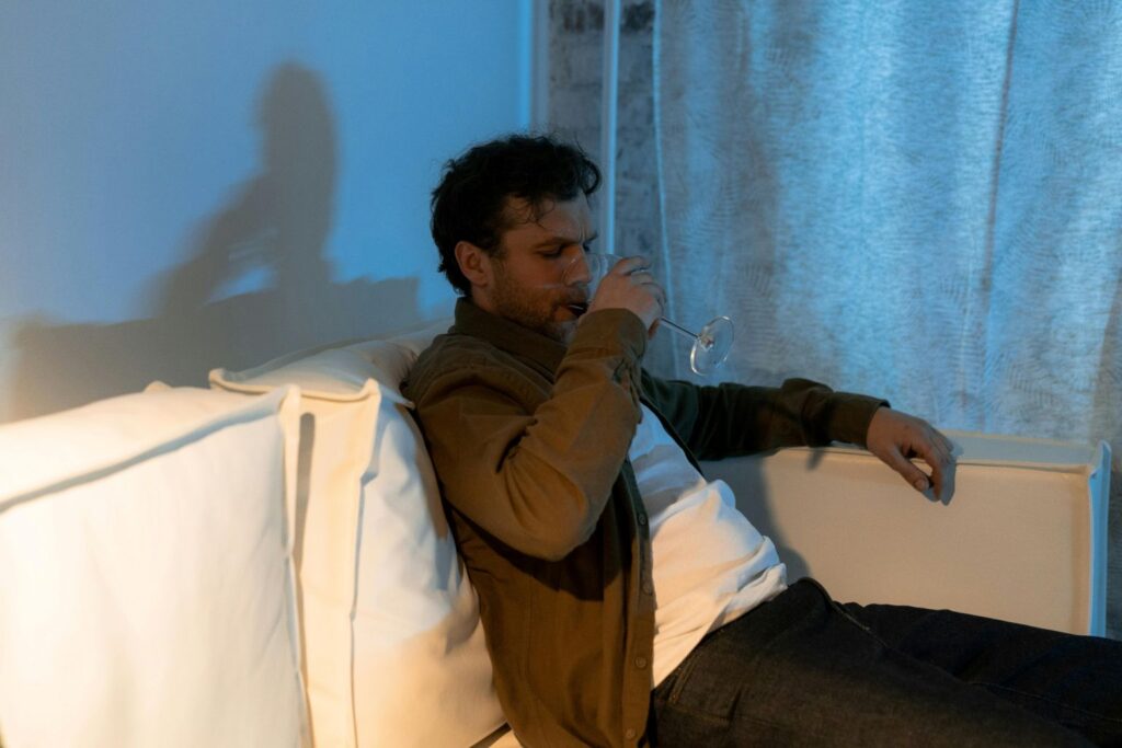 A man drinking wine