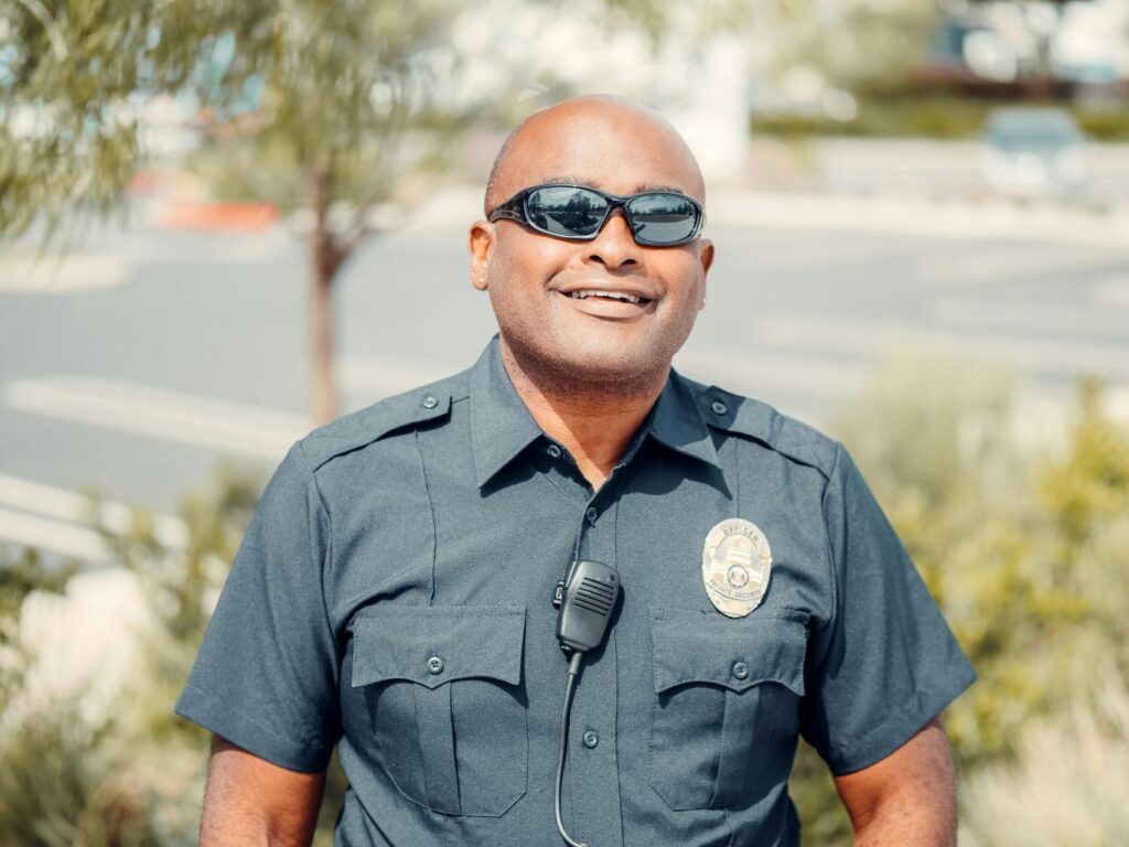 A police officer smiling