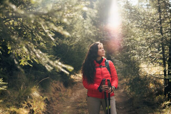 a woman on a hike enjoying the outdoors