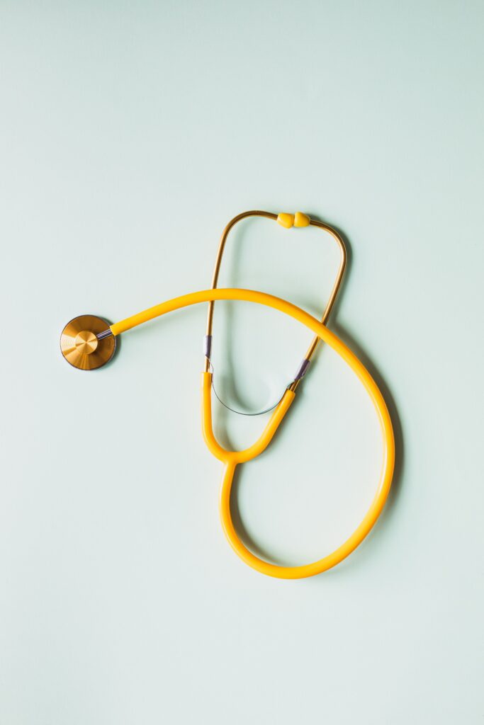 a yellow stethoscope on a blue background