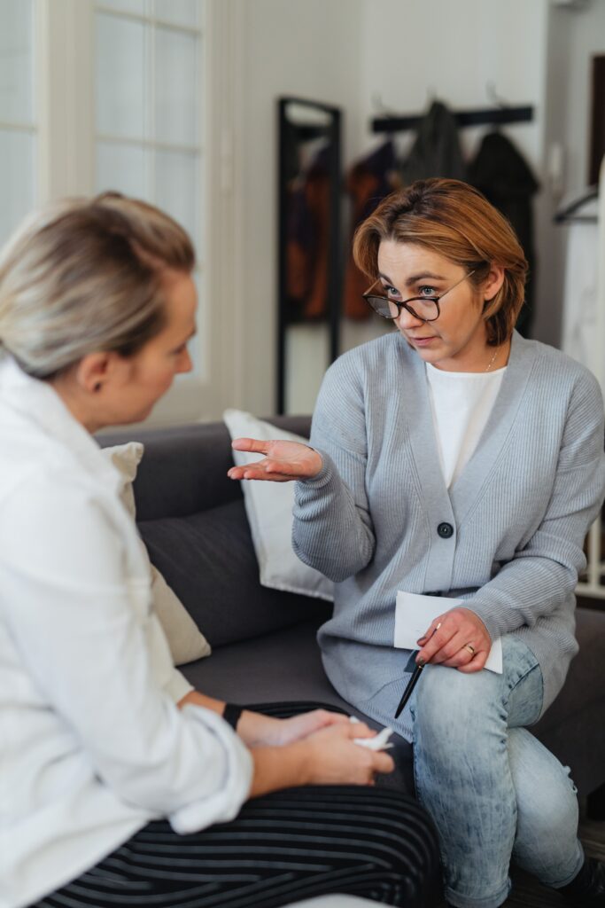 female therapist talking to female patient